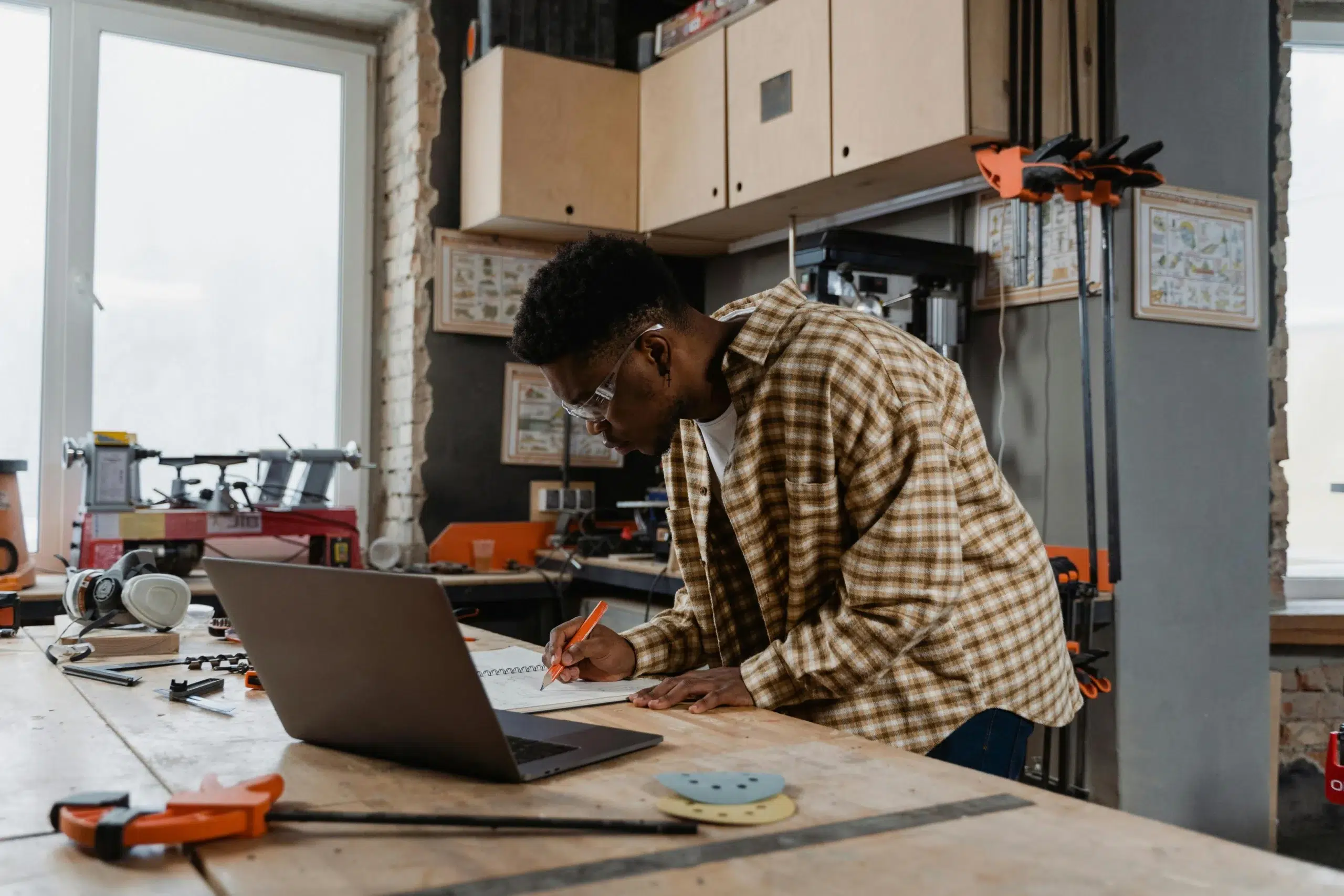 A maintenance engineer documenting work order history and technical specifications into a centralized CMMS to ensure standardized maintenance operations across APAC plants.